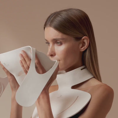 Video: woman fitting and wearing the illuminated LumaLux Face+ V2 face and neck mask